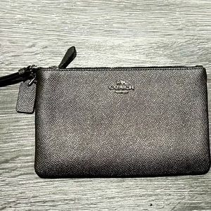 Coach wristlet in pewter. New, never worn.